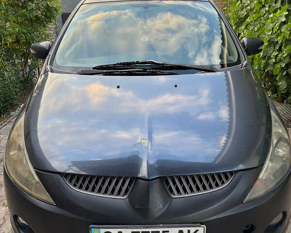 Серый Мицубиси Грандис, объемом двигателя 2.38 л и пробегом 271 тыс. км за 5400 $, фото 1 на Automoto.ua