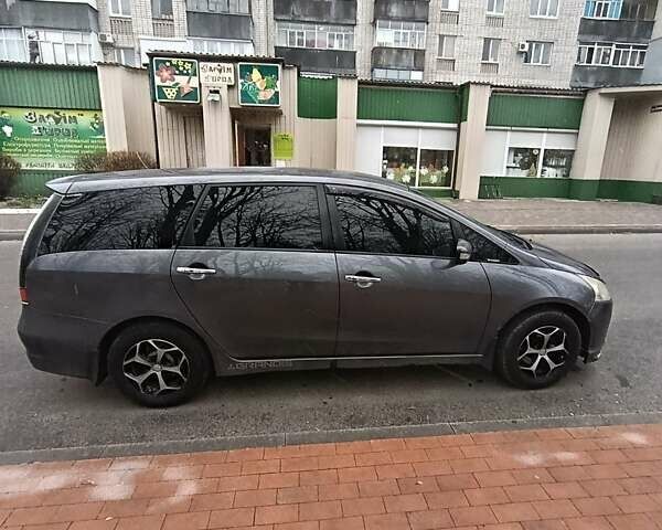 Серый Мицубиси Грандис, объемом двигателя 2.38 л и пробегом 153 тыс. км за 7300 $, фото 1 на Automoto.ua