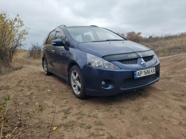 Синий Мицубиси Грандис, объемом двигателя 2.4 л и пробегом 220 тыс. км за 6500 $, фото 1 на Automoto.ua