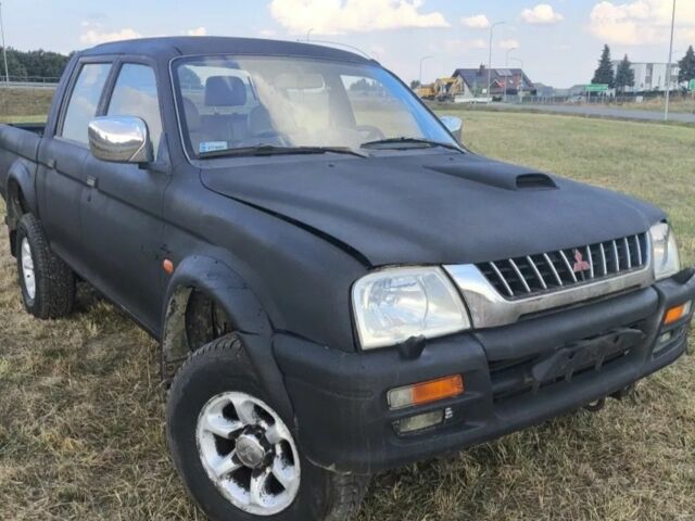 Чорний Міцубісі Л 200, об'ємом двигуна 0 л та пробігом 310 тис. км за 1802 $, фото 1 на Automoto.ua