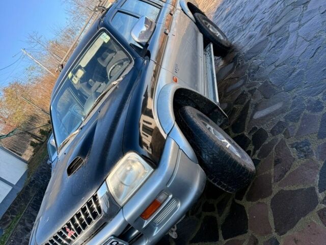 Черный Мицубиси Л 200, объемом двигателя 0 л и пробегом 225 тыс. км за 5205 $, фото 1 на Automoto.ua