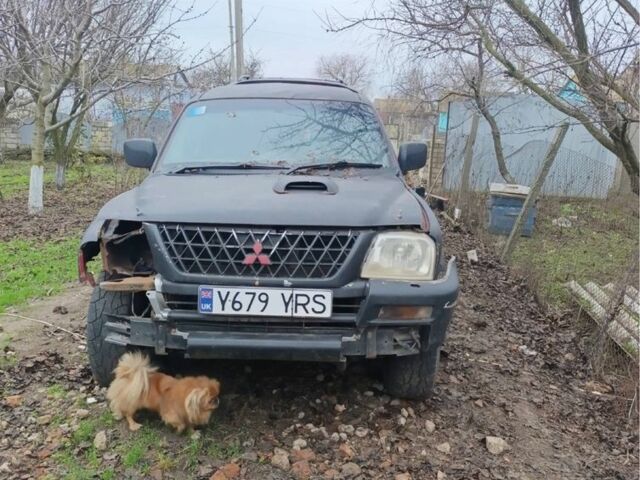Черный Мицубиси Л 200, объемом двигателя 2.5 л и пробегом 500 тыс. км за 2611 $, фото 1 на Automoto.ua