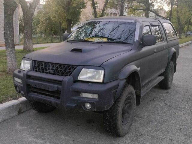 Чорний Міцубісі Л 200, об'ємом двигуна 2.5 л та пробігом 238 тис. км за 4500 $, фото 1 на Automoto.ua