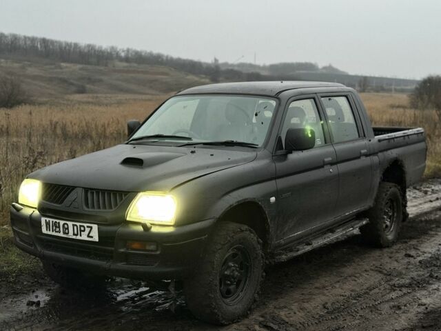 Черный Мицубиси Л 200, объемом двигателя 0 л и пробегом 232 тыс. км за 4100 $, фото 1 на Automoto.ua