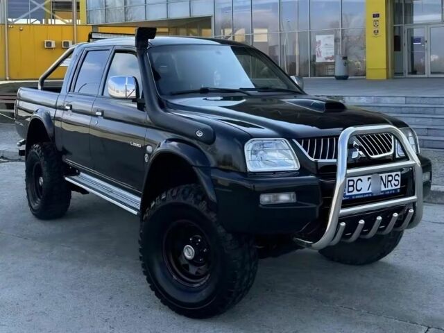 Мицубиси Л 200 2003 в Сумах на Automoto.ua Черный Мицубиси Л 200, объемом двигателя 2.5 л и пробегом 255 тыс. км за 2500 $, фото 1 на Automoto.ua