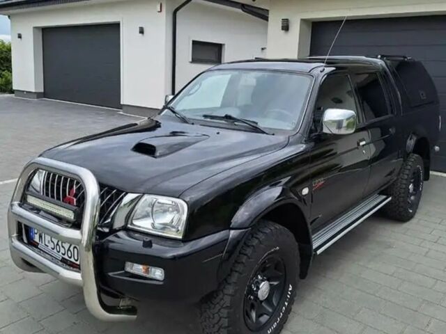 Чорний Міцубісі Л 200, об'ємом двигуна 2.5 л та пробігом 231 тис. км за 2683 $, фото 1 на Automoto.ua