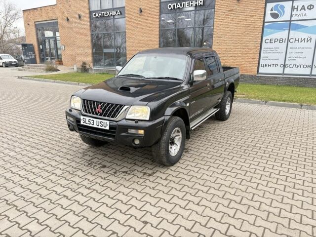Чорний Міцубісі Л 200, об'ємом двигуна 2.5 л та пробігом 167 тис. км за 6647 $, фото 1 на Automoto.ua