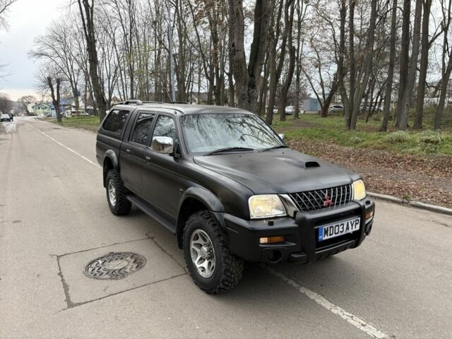 Чорний Міцубісі Л 200, об'ємом двигуна 2.5 л та пробігом 167 тис. км за 5674 $, фото 1 на Automoto.ua