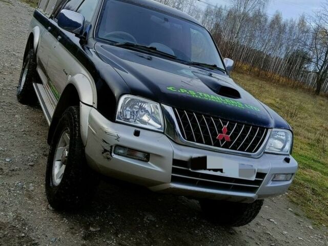 Чорний Міцубісі Л 200, об'ємом двигуна 2.5 л та пробігом 160 тис. км за 5600 $, фото 1 на Automoto.ua