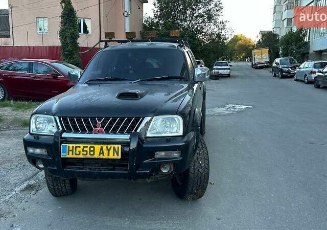 Чорний Міцубісі Л 200, об'ємом двигуна 2.5 л та пробігом 240 тис. км за 6054 $, фото 1 на Automoto.ua