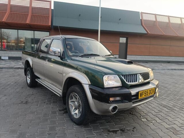 Черный Мицубиси Л 200, объемом двигателя 2.5 л и пробегом 300 тыс. км за 5100 $, фото 1 на Automoto.ua