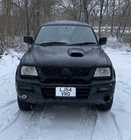 Чорний Міцубісі Л 200, об'ємом двигуна 2.9 л та пробігом 180 тис. км за 7573 $, фото 1 на Automoto.ua