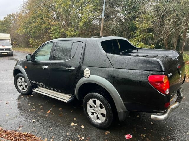 Черный Мицубиси Л 200, объемом двигателя 2.5 л и пробегом 190 тыс. км за 6655 $, фото 1 на Automoto.ua