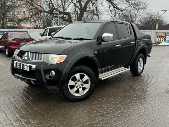 Черный Мицубиси Л 200, объемом двигателя 2.5 л и пробегом 160 тыс. км за 6500 $, фото 1 на Automoto.ua