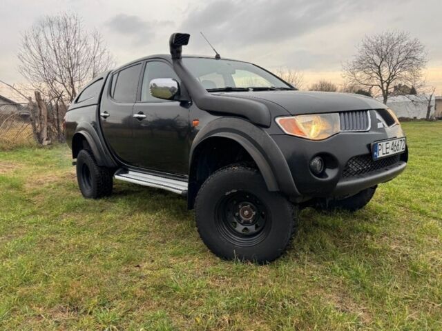 Черный Мицубиси Л 200, объемом двигателя 2.5 л и пробегом 236 тыс. км за 2850 $, фото 1 на Automoto.ua