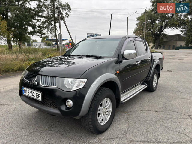 Чорний Міцубісі Л 200, об'ємом двигуна 2.5 л та пробігом 208 тис. км за 12800 $, фото 1 на Automoto.ua