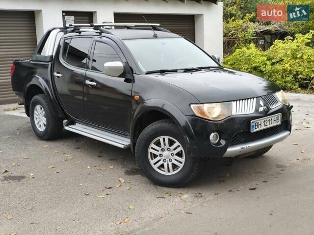 Черный Мицубиси Л 200, объемом двигателя 2.48 л и пробегом 260 тыс. км за 9500 $, фото 1 на Automoto.ua