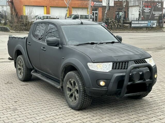 Чорний Міцубісі Л 200, об'ємом двигуна 2.5 л та пробігом 128 тис. км за 5650 $, фото 1 на Automoto.ua
