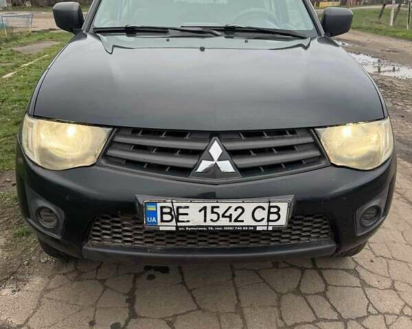 Черный Мицубиси Л 200, объемом двигателя 2.48 л и пробегом 295 тыс. км за 14800 $, фото 1 на Automoto.ua