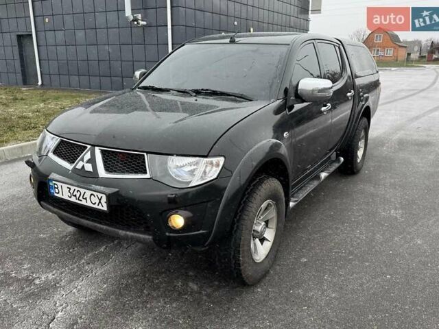 Чорний Міцубісі Л 200, об'ємом двигуна 2.48 л та пробігом 270 тис. км за 16500 $, фото 1 на Automoto.ua