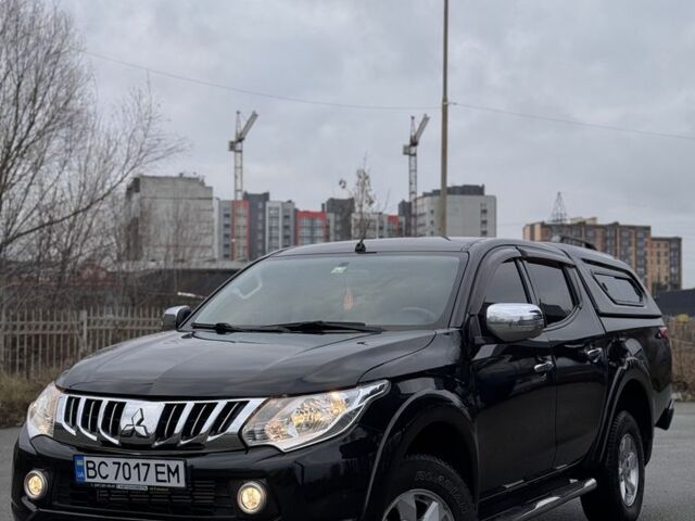 Черный Мицубиси Л 200, объемом двигателя 2.4 л и пробегом 186 тыс. км за 22200 $, фото 1 на Automoto.ua