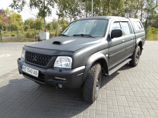 Чорний Міцубісі Л 200, об'ємом двигуна 2.5 л та пробігом 260 тис. км за 8200 $, фото 1 на Automoto.ua