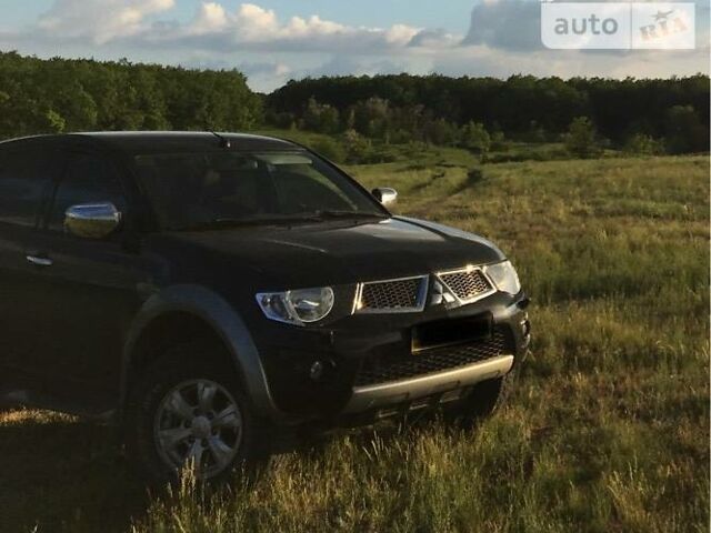 Чорний Міцубісі Л 200, об'ємом двигуна 2.5 л та пробігом 105 тис. км за 16700 $, фото 1 на Automoto.ua