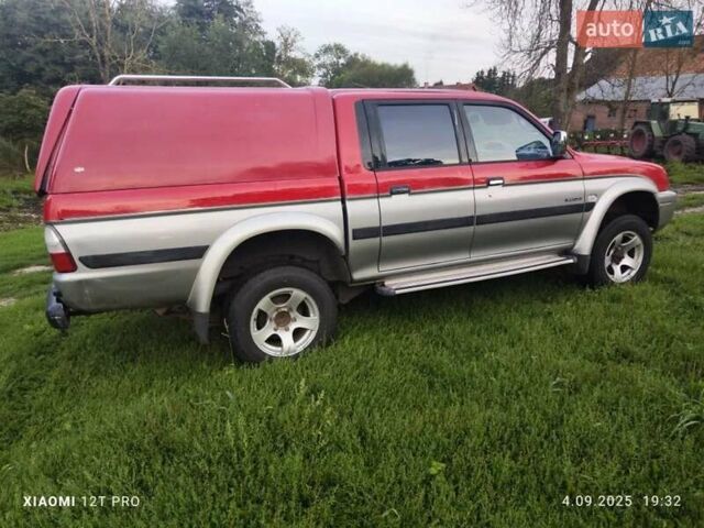 Красный Мицубиси Л 200, объемом двигателя 2.5 л и пробегом 272 тыс. км за 3200 $, фото 1 на Automoto.ua