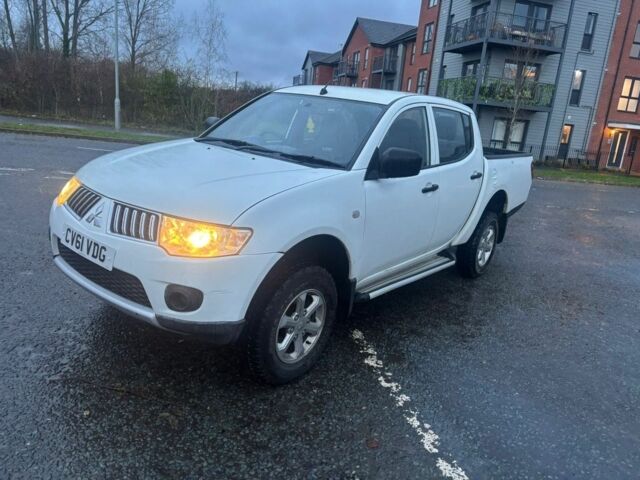 Красный Мицубиси Л 200, объемом двигателя 0 л и пробегом 98 тыс. км за 7044 $, фото 1 на Automoto.ua