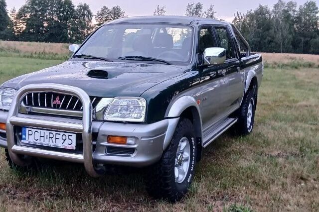 Серый Мицубиси Л 200, объемом двигателя 2.5 л и пробегом 219 тыс. км за 2650 $, фото 1 на Automoto.ua