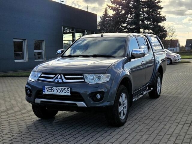 Серый Мицубиси Л 200, объемом двигателя 2.5 л и пробегом 130 тыс. км за 5222 $, фото 1 на Automoto.ua