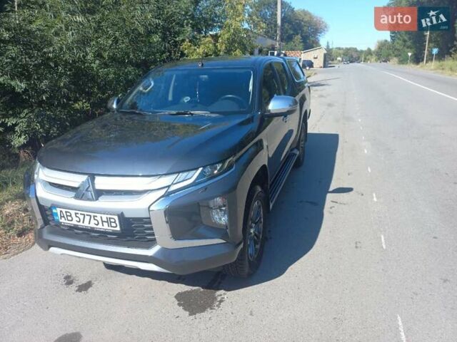 Серый Мицубиси Л 200, объемом двигателя 2.44 л и пробегом 57 тыс. км за 34500 $, фото 1 на Automoto.ua