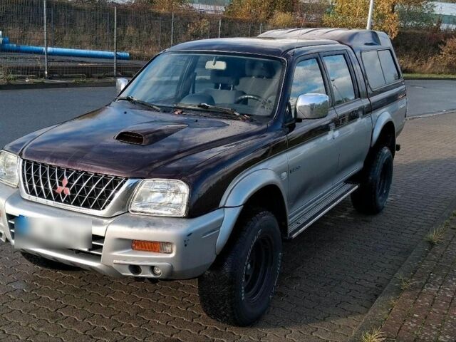 Серый Мицубиси Л 200, объемом двигателя 2.5 л и пробегом 183 тыс. км за 2500 $, фото 1 на Automoto.ua