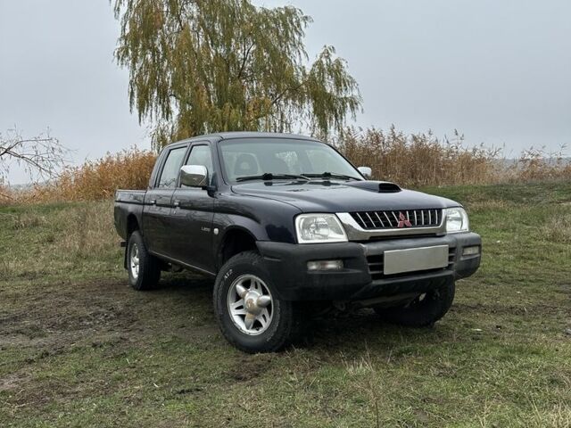 Синій Міцубісі Л 200, об'ємом двигуна 2.5 л та пробігом 321 тис. км за 4455 $, фото 1 на Automoto.ua