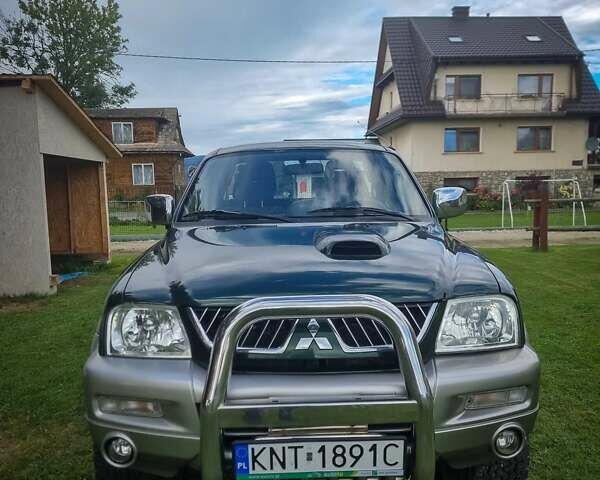 Зеленый Мицубиси Л 200, объемом двигателя 2.5 л и пробегом 268 тыс. км за 3100 $, фото 1 на Automoto.ua
