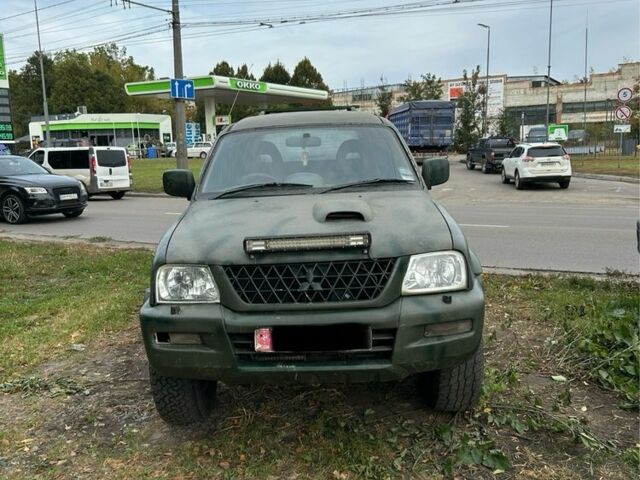 Зеленый Мицубиси Л 200, объемом двигателя 2.5 л и пробегом 200 тыс. км за 4005 $, фото 1 на Automoto.ua