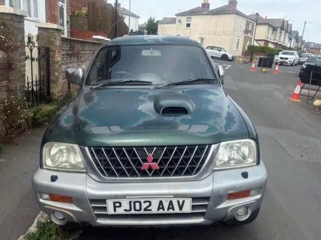 Зеленый Мицубиси Л 200, объемом двигателя 0 л и пробегом 240 тыс. км за 6100 $, фото 1 на Automoto.ua