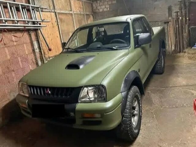 Зеленый Мицубиси Л 200, объемом двигателя 2.5 л и пробегом 259 тыс. км за 3597 $, фото 1 на Automoto.ua