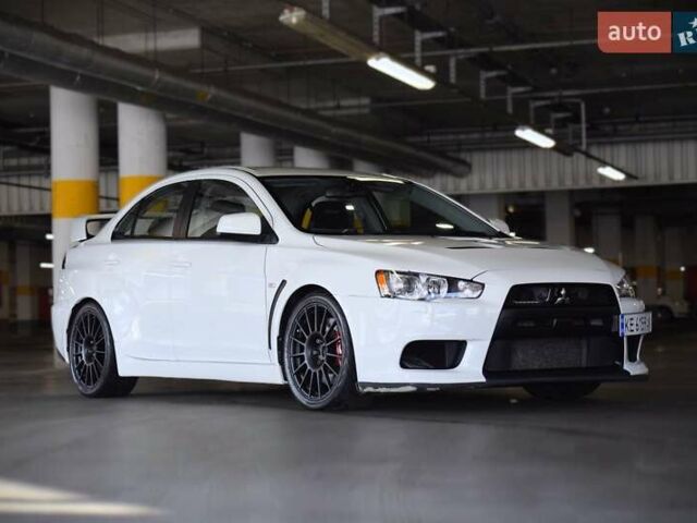 Білий Міцубісі Лансер Еволюшн, об'ємом двигуна 2 л та пробігом 96 тис. км за 24900 $, фото 1 на Automoto.ua
