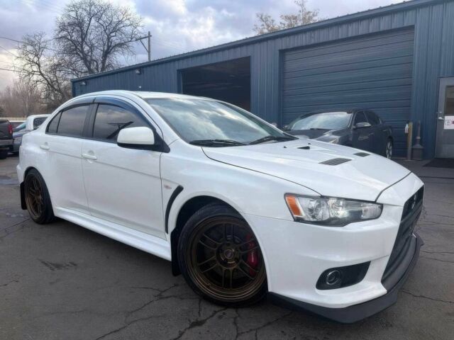 Білий Міцубісі Лансер Еволюшн, об'ємом двигуна 2 л та пробігом 82 тис. км за 6400 $, фото 1 на Automoto.ua