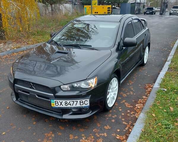 Черный Мицубиси Лансер Эволюшн, объемом двигателя 2 л и пробегом 116 тыс. км за 16900 $, фото 1 на Automoto.ua