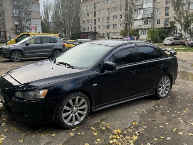 Чорний Міцубісі Лансер Еволюшн, об'ємом двигуна 2 л та пробігом 180 тис. км за 5506 $, фото 1 на Automoto.ua