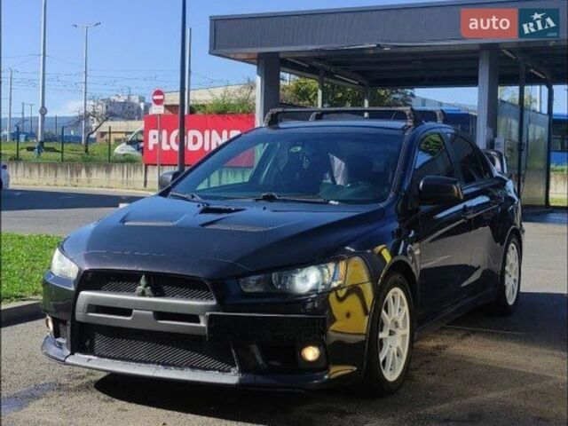 Черный Мицубиси Лансер Эволюшн, объемом двигателя 2 л и пробегом 134 тыс. км за 21000 $, фото 1 на Automoto.ua