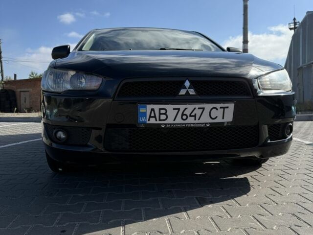 Чорний Міцубісі Лансер Еволюшн, об'ємом двигуна 2 л та пробігом 223 тис. км за 7000 $, фото 1 на Automoto.ua
