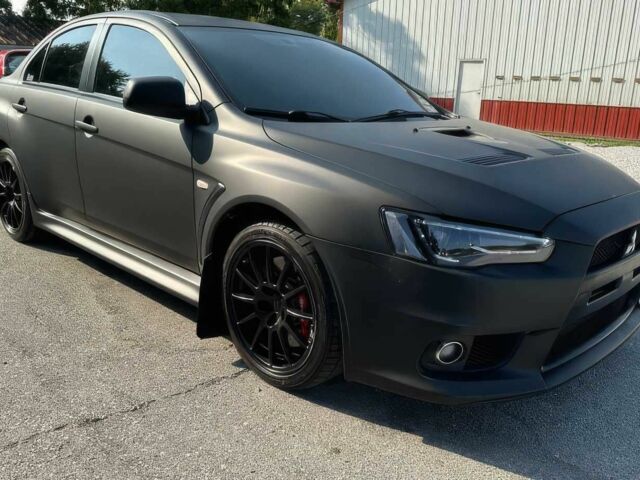 Черный Мицубиси Лансер Эволюшн, объемом двигателя 2 л и пробегом 153 тыс. км за 3000 $, фото 1 на Automoto.ua