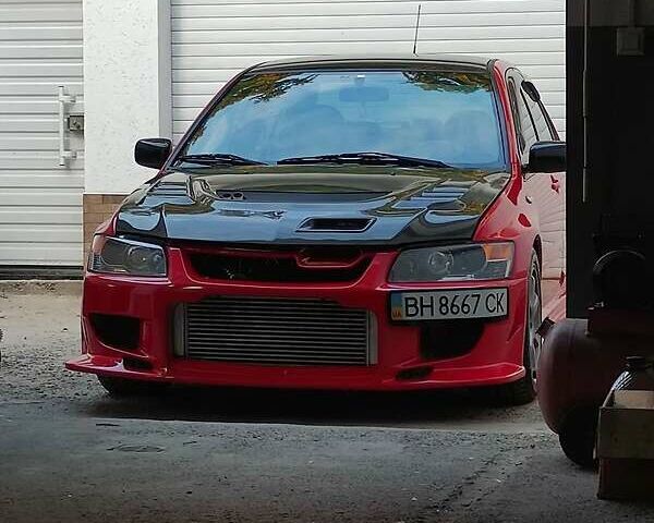 Красный Мицубиси Лансер Эволюшн, объемом двигателя 2 л и пробегом 30 тыс. км за 50000 $, фото 1 на Automoto.ua