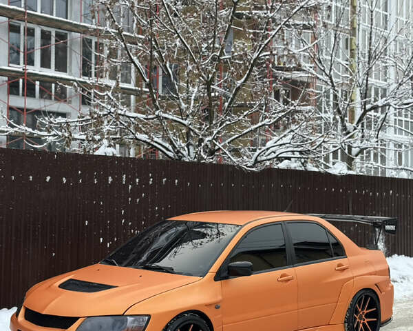 Красный Мицубиси Лансер Эволюшн, объемом двигателя 2 л и пробегом 125 тыс. км за 26000 $, фото 1 на Automoto.ua