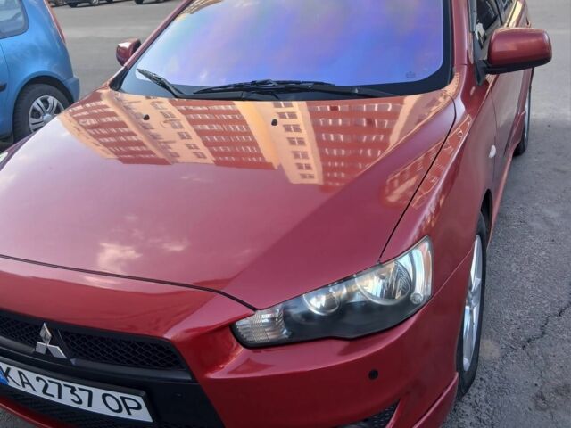 Червоний Міцубісі Лансер Еволюшн, об'ємом двигуна 2 л та пробігом 259 тис. км за 7600 $, фото 1 на Automoto.ua