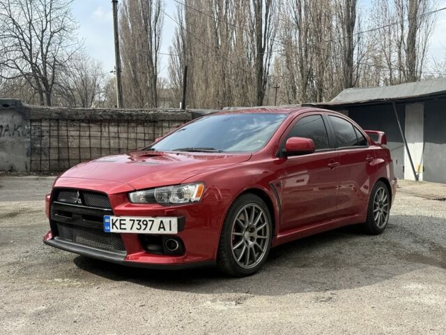 Червоний Міцубісі Лансер Еволюшн, об'ємом двигуна 2 л та пробігом 105 тис. км за 16700 $, фото 1 на Automoto.ua
