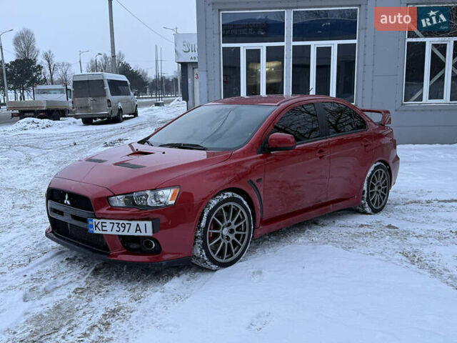 Червоний Міцубісі Лансер Еволюшн, об'ємом двигуна 2 л та пробігом 105 тис. км за 16700 $, фото 1 на Automoto.ua